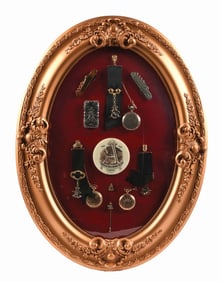 FRAMED SHADOW BOX OF NUMEROUS ANHEUSER-BUSCH SMALLS