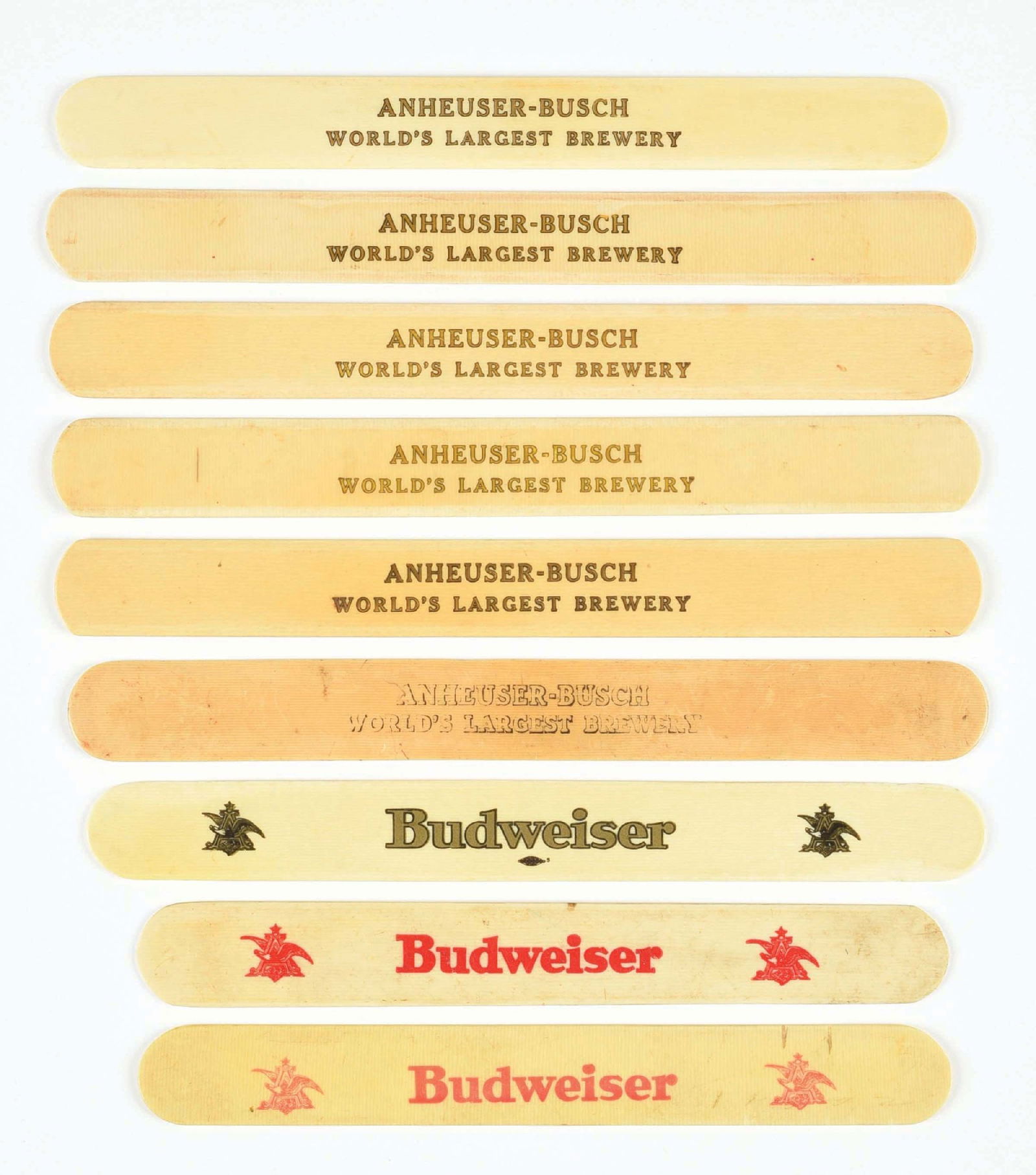 LOT OF 9: ANHEUSER-BUSCH FOAM SCRAPERS: CONDITION: All show some general wear, several with more significant wear. Condition: (6.0 - 8.0) Dimensions: Largest: 10 - 1/4" L.