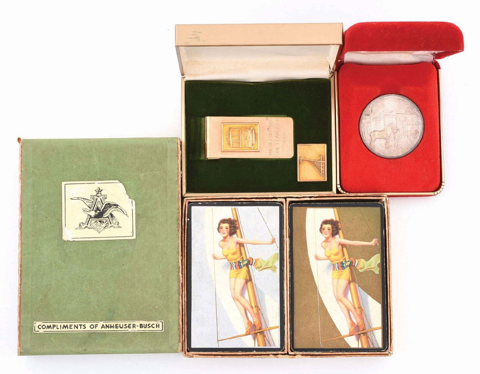 LOT OF 3: ANHEUSER-BUSCH & MICHELOB ADVERTISING PIECES: (A) A 1969 Michelob 400 San Francisco engraved money clip and pin in the original box with light wear. Both are gold-filled. (B) A 1973 .999 Pure Silver Limited Edition of 5000 Anheuser-Busch coin. It
