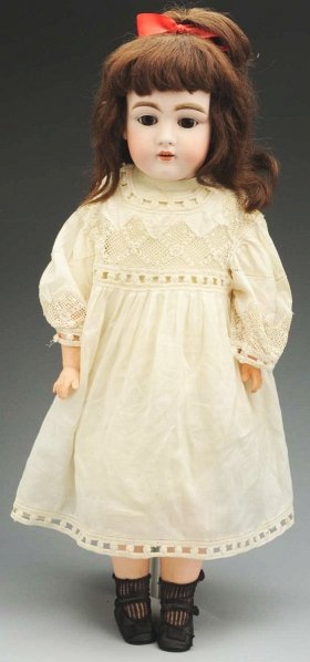 Pretty Kestner “Dainty Dorothy” Doll.: Bisque shoulder head incised “154” by J.D. Kestner, sleeping eyes, painted upper and lower lashes, open mouth with teeth, antique wig; white kid body with rivet-jointed hips and knees with composi