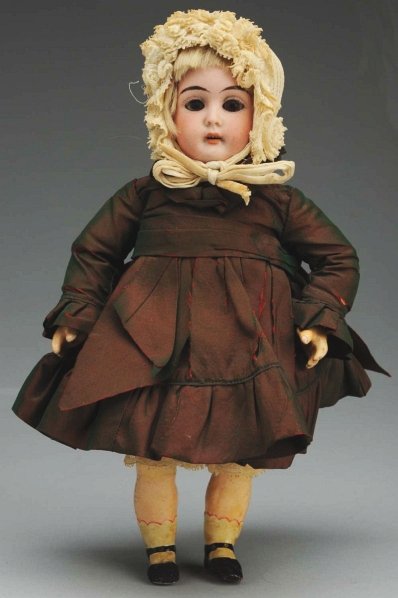 Dainty German Bisque Child Doll.: Bisque socket head incised “WSK 4/0” made by Wiesenthal, Schindel & Kallenberg with sleeping eyes, long tapered eyebrows, open mouth with teeth, plaster dome, original blonde mohair wig; original