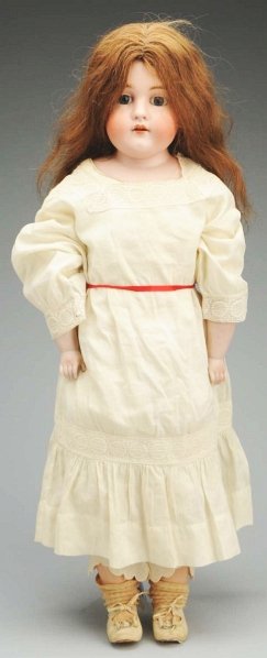 Large Kestner “Dainty Dorothy” Doll.: Bisque shoulder head incised “154” by J.D. Kestner, replaced eyes, no upper lashes, painted lower lashes, open mouth with teeth, antique human hair wig; white kid body with rivet-jointed hips and 