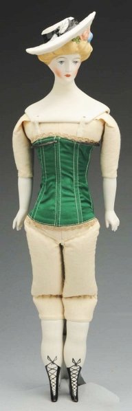 Emma Clear Parian Doll.: Signed clear, “Gibson Girl” with blonde hair and molded angled hat, painted facial features, original body with Parian limbs. Condition (Excellent). Size 17" T.