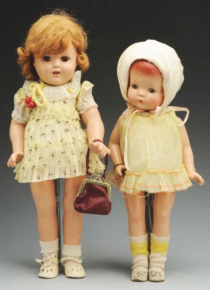 Lot of 2: American Composition Dolls.: Both all-composition. Effanbee “Patsy Joan” with red molded hair, perfect lashed sleeping eyes, rosy cheeks, original dress, undies and shoes and metal heart bracelet, replaced hat and socks. Girl