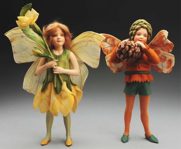 Lot of 2: R. John Wright Dolls.: Molded felt “Flower Fairies,” all original with hand-painted features and jointed arms and legs. “The Pine Tree Fairy” and “The Primrose Fairy” with labels. Condition (Excellent). Size 11"