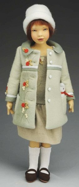 Maggie Iacono Artist Doll.: All molded felt “Maggie Made” girl with label, hand-painted features, mohair wig, ball-jointed at shoulders, elbows, hips and knees; all original with undies, dress, coat, hat, shoes and socks. Co