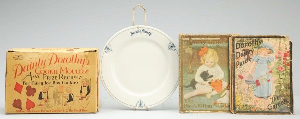 Lot of 4: "Dainty Dorothy/Dorothy Dainty” Items.: "Dainty Dorothy’s Cookie Moulds and Prize Recipes for Fancy Ice Box Cookies” with booklets in original box (some wear on box); “Dorothy Dainty” blue and white plate by Meyer China; “Dorothy 