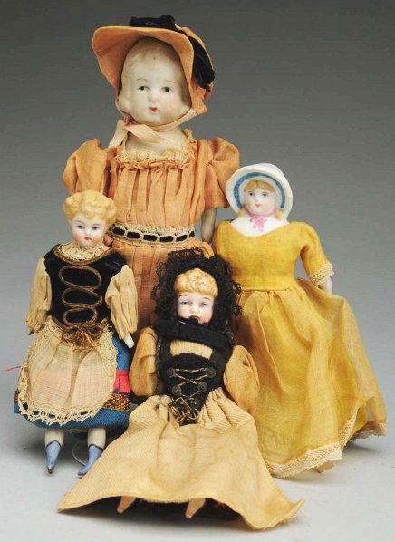 Lot of 4: Bisque Doll House Dolls.: Lovely early doll house lady with molded blonde hair, pained features, cloth body with bisque lower arms and legs with blue boots, all original clothing; another similar with black painted boots and o