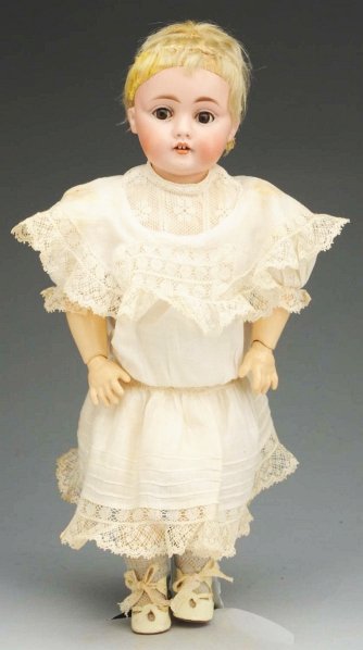 Winsome German Bisque Child Doll.: Bisque socket head incised “B made in Germany 6 143” made by J.D. Kestner, sleeping eyes, multi-stroked eyebrows, open mouth with 2 upper teeth, remains of blonde mohair wig; original jointed comp