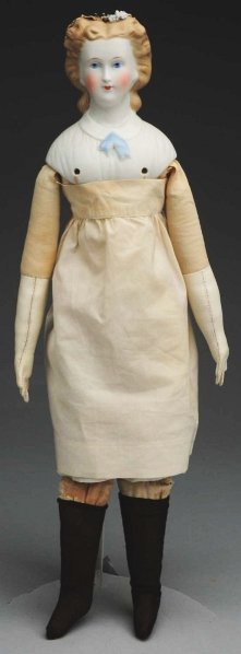 Lovely Parian Lady Doll.: German shoulder head with dark blonde hair brushed back at sides and curled under in back with a molded black snood and applied black ruffle with gilded trim and a few applied tiny flowers (a few smal