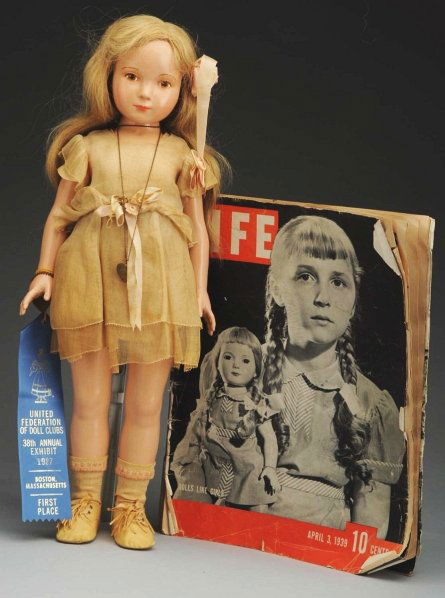 Effanbee Dewees Cochran Child Doll.: “Gloria Vanderbilt” all-composition unmarked designed by Dewees Cochran with painted eyes, eye shadow, painted upper lashes, stroked eyebrows, closed mouth, original human hair wig; jointed should