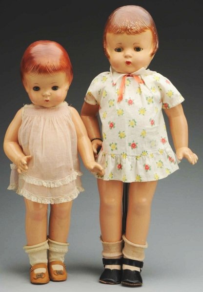 Lot of 2: Effanbee Patsy Family Dolls.: Both are all composition, fully marked, with molded reddish hair, lashed sleeping eyes, closed mouths, jointed neck, shoulders and hips. “Patsy Ann” (light overall soil), original pink organdy dre