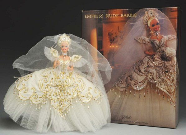 Bob Mackie “Empress Bride Barbie".: Elegant gold and white outfit, 5th in the Bob Mackie Series, in original box. Condition (Excellent).