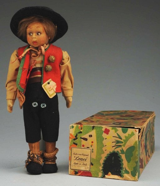 Lenci Cloth Boy Doll.: All cloth with molded face (discoloration), mohair wig, all original felt and cloth costume with hat and partial label, original labeled Lenci box, with some deterioration particularly to lid. Conditi