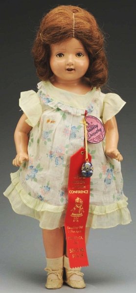Composition “Dainty Dorothy” Doll.: Very rare model from Sears, Roebuck 1932 catalog with composition shoulder head, lashed sleeping eyes, original human hair wig, open mouth with teeth, cloth torso, composition arms (light finger wear)