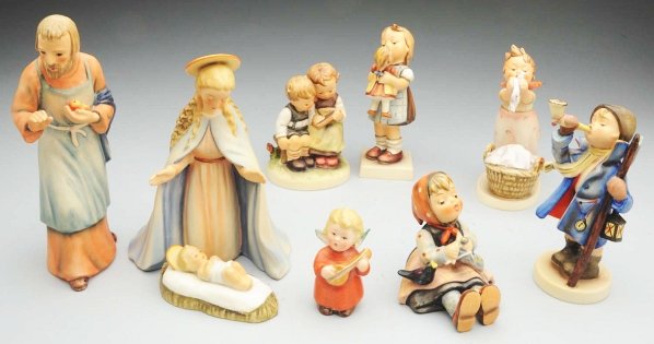 Lot of 8: Hummel Figurines.: Lovely group of figures, all signed M.I. Hummel with various Goebel trademarks, the boy with the horn and lantern is the earliest with the large B in V trademark. Along with a little angel, not a Humm