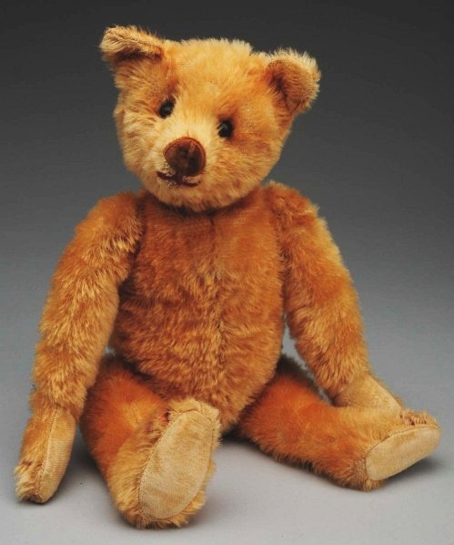 Very Rare Velvet Nose Teddy Bear.: Identified from Teddy Bear and Friends magazine as a rare Heinrich Silberstein model from Germany 1905-1910. Golden short mohair teddy, rare velvet nose, stitched mouth and claws, shoe button eyes, ve