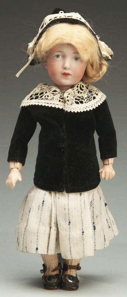 Pensive K & R 109 “Elise” Character Doll.: German bisque socket head incised “K [star] R 109” made by Kammer & Reinhardt (speckling, wig pull), tapered eyebrows, blue painted eyes, black eyelash line, closed mouth, chin dimple, antique blo