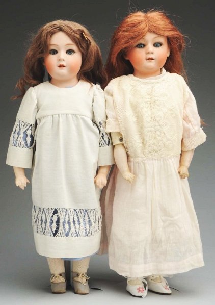 Lot of 2: Heubach “Dainty Dorothy” Dolls.: Bisque shoulder heads incised “10633 Gebruder Heubach” sleeping eyes, open mouths with upper teeth, mohair wigs; white kid body with rivet-jointed hips and knees with composition arms (soil, wear,
