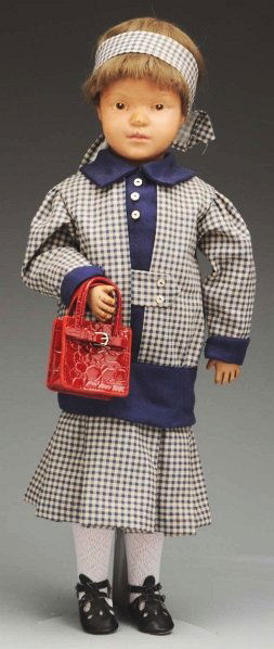 Schoenhut All-Wood Doll.: Impressed mark, character face, (nose and philtrum touched up and discolored, light cheek crazing), brown intaglio eyes with carved eye sockets, closed mouth, original brown bobbed mohair wig; fully s