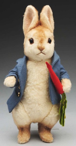 R. John Wright “Peter Rabbit".: Shaded mohair with inset eyes and sewn nose and mouth, original jacket and carrot, with label, no box or certificate. Condition (Excellent). Size 12" T (including ears).