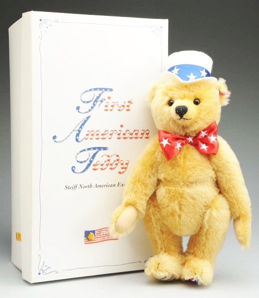 Steiff First American Teddy Bear.: Limited Edition 2003, golden mohair, fully jointed with Steiff button and special striped ear tag #667183, limited edition #400 with certificate in original box. Condition (Excellent). Size 15" T.