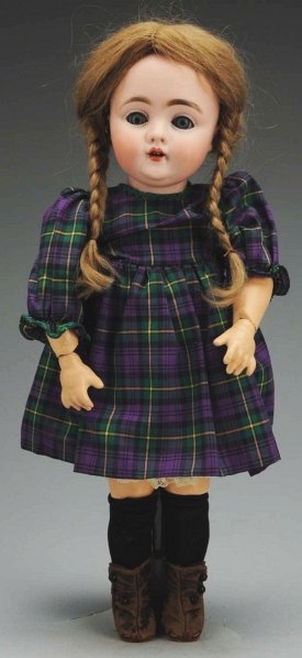 Cute German Bisque Child Doll.: Socket head incised “C made in Germany 7”, the 143 face made by J.D. Kestner, sleeping eyes, open mouth with 2 upper teeth, plaster pate, antique light brown mohair wig with braids; new jointed co