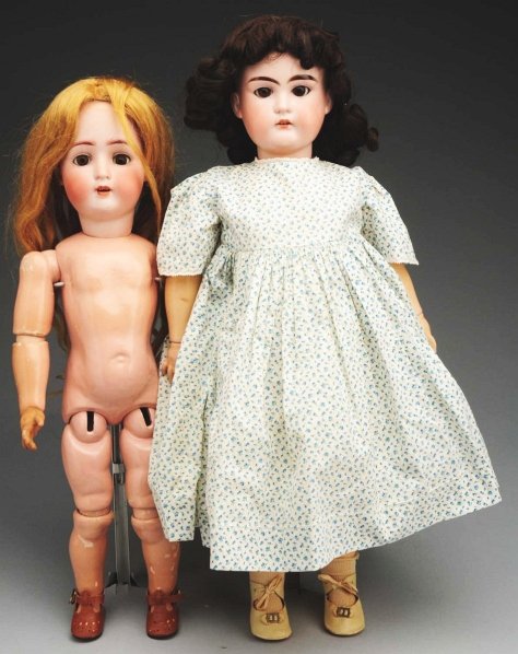 Lot of 2: German Bisque Dolls.: Both with bisque socket heads, sleeping eyes, open mouths and jointed composition bodies. “H.W.&Co. made in Germany A.M.” made by Armand Marseille for Hugo Wiegand, replaced wig (body with normal 