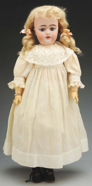 Pretty German Bisque Child Doll.: Socket head incised “Made in Germany D ½ 8 ½ “ made by J.D. Kestner (light cheek rub), sleeping eyes, open mouth with upper teeth, original blonde mohair wig, plaster dome; original Kestner join