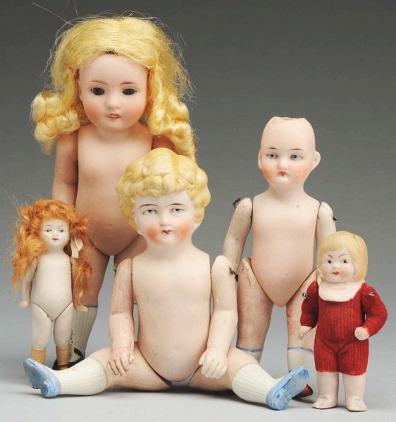 Lot of 5: German All-Bisque Dolls.: Alt, Beck & Gottschalck 83/150 child with glass eyes, open mouth with teeth, original blonde wig, jointed shoulders and hips, molded white hose with black slippers; Limbach pouty child with blonde hai