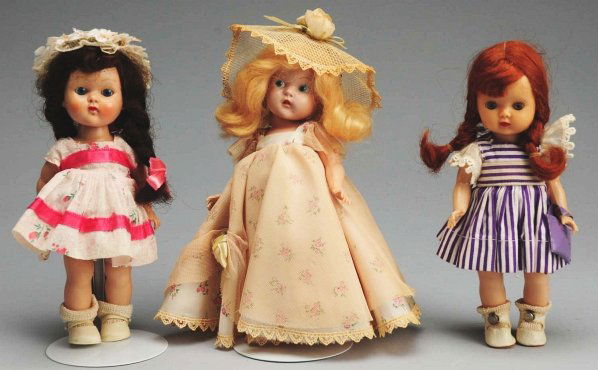 Lot of 3: Hard Plastic Dolls.: “Muffie” with red braids, original purple striped dress, undies, shoes and socks; early painted-eye “Ginny” looks all original with tag but lettering has faded out, undies, shoes and socks; ��