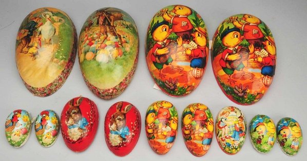 Lot of 7: Cardboard Eggs.: Germany candy containers. Very large antique one with rabbit and ducks; red antique one with rabbit head; very large Western Germany one; 2 smaller Western Germany (1 missing lid); 2 German Democratic