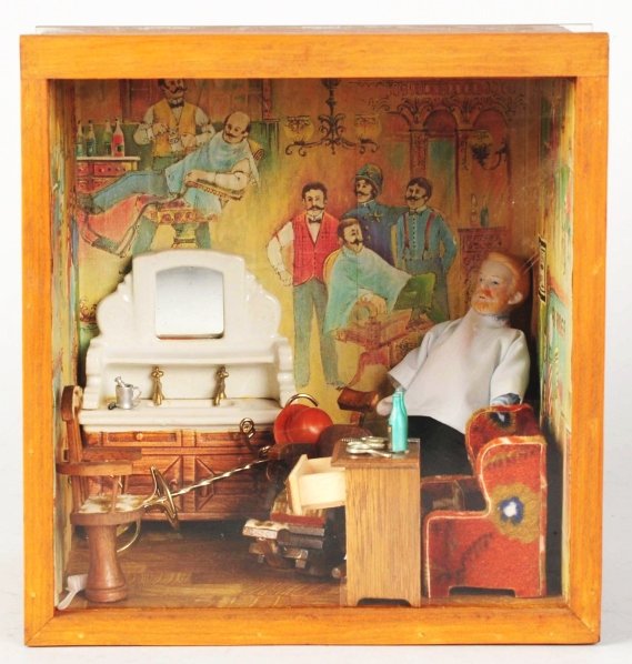 Barbershop Diorama in Wooden Case.: Constructed in 1977. Has plastic lift out front. Includes porcelain figure of a barber with homemade furniture, including a barber chair, sink, etc. Condition (Excellent). Size 10" x 9 - 1/2" x 8".