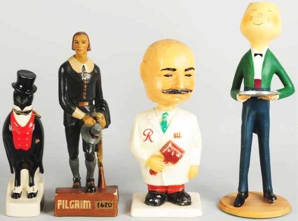 Lot of 4: Advertising Figures.: 1950s to 1960s. Includes Old Crow, Rainer Beer, Coronet Brandy, and Pilgrim Whiskey. Ceramic, foam, plastic, and plaster. Condition (Excellent). Size Largest: 19 - 1/4" T.