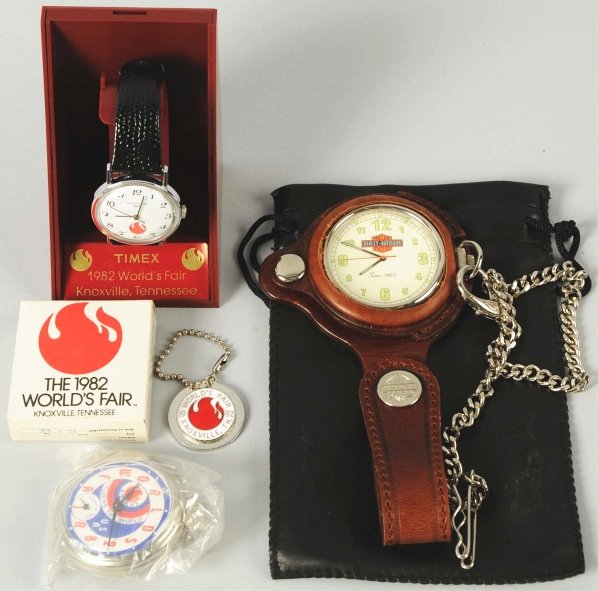 Lot of 3: World's Fair & Harley Davidson Watches.: Contemporary. Includes one wrist watch and one pocket watch from the 1982 World's Fair in Tennessee. Both with original boxes. Also includes one Harley Davidson pocket watch on chain (not working). Co