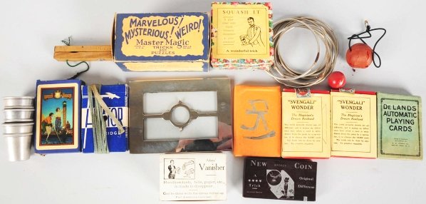 Large Lot of Magic Tricks.: Includes decks of cards, hoops, cups, balls, coins, and others various magic tricks. Condition (Very Good - Excellent). Size Largest: 7 - 1/4" L.