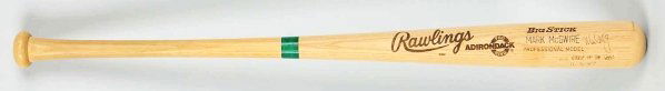 Mark McGwire Autographed Baseball Bat.: Rawlings Big Stick full-size (34 - 1/2") baseball bat signed by Mark McGuire and also signed "AL Rookie of the Year 11-3-87". Autographed in black fiber-tip marker right after the "Mark McGwire " mark