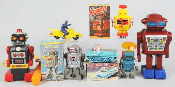 Lot of 7: Robot Toys.: Includes a plastic and tin litho battery-operated robot (working), one battery-operated plastic Robby Robot from a Billy Blastoff set (untested), one contemporary plastic Space Cycle (working), one pl