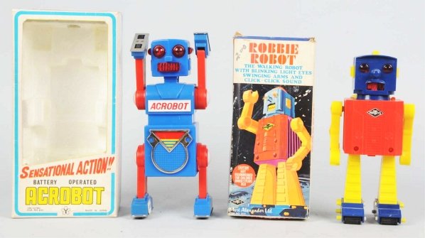 Lot of 2: Robot Toys.: Includes a plastic and metal battery-operated Robbie Robot made by Mortoys (not working). Comes with original box. Also includes a tin litho and plastic battery-operated Acrobot made by Yonezawa (work