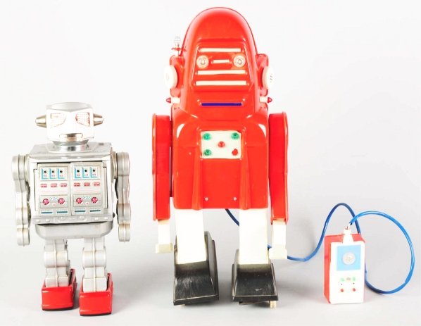 Lot of 2: Tin Toys.: Includes a tin litho and painted battery-operated Giant Robot made by Horikawa. Some areas of oxidation, some oxidation to chrome mouth, and other areas with touchup. Also includes tin litho and plast