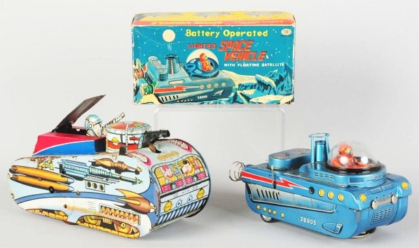 Lot of 2: Robot Toys.: Includes a tin litho and painted battery-operated Lighted Space Vehicle made by Modern Toys with original box. Light bulbs in the back are replacements and the toy is not working. Original box with fa