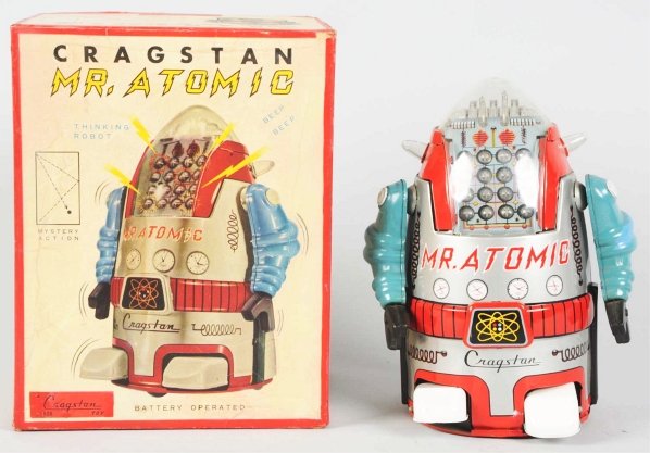 Tin Litho Mr. Atomic Robot in Silver.: Japanese. Made by Yonezawa. Battery-operated and working. One small stress line to side of dome and one area of wear to the right foot. Also, some areas of touchup to each arm and some staining and ox