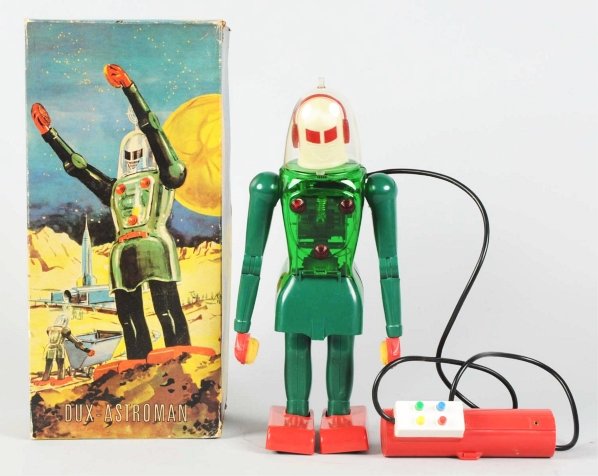 Plastic Battery-Operated Dux-Astroman.: West-Germany. Made by Dux. Toy is not working. Comes with the original sleeve for the antenna but the antenna is missing. Also, missing two red buttons on the back of the robot and one break to one of