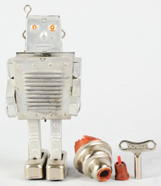 Tin Litho Pneumatic Nando Robot.: Made in Italy. Working. Some of the facial decal is missing and some oxidation to the chrome throughout. Also, the bulb has deteriorated and the hose that runs to the robot from the bulb is not presen