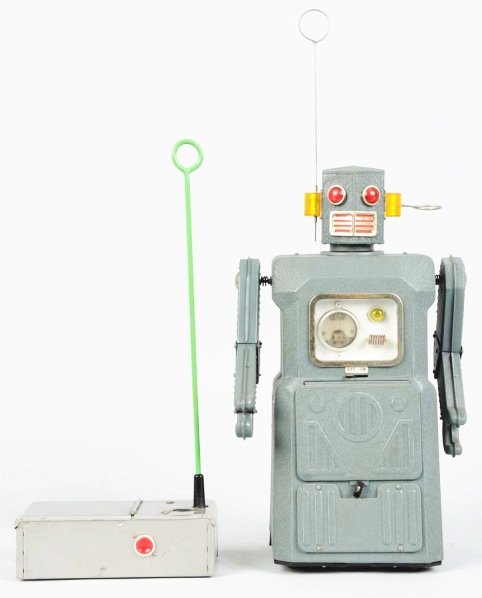 Painted Tin Battery-Operated Radicon Robot.: Japanese. Made by Masudaya. One of the gang of five. Working. Some oxidation and flaking to the chrome, mouth, ears, and eyes. Also, some oxidation to the antenna and some discoloration around the chr
