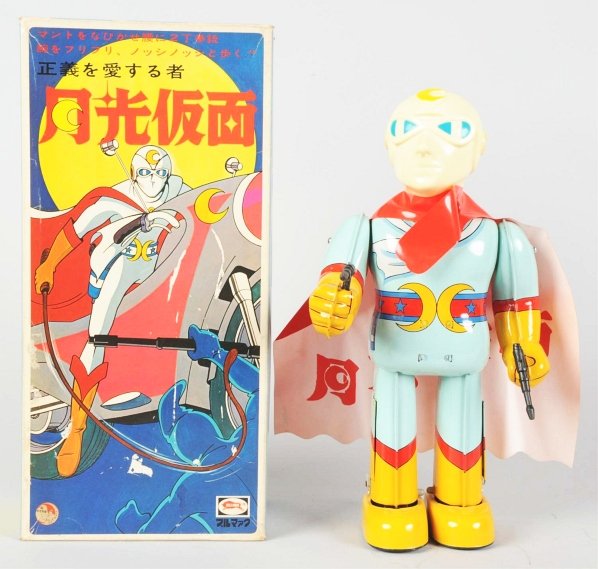 Tin Litho Battery-Operated Moonlight Man.: Japanese. Made by Bullmark. Working. Minor residue on original cape. Includes original box with all original inserts. Toy (Near Mint) Box (Near Mint). Size 12" T.