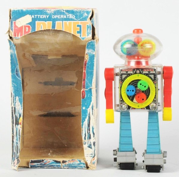 Plastic & Tin Litho Battery-Operated Mr. Planet.: Japanese. Made by Yonezawa. Working. Some fogginess to the domed face. Includes original box missing portions of the paper and has several tears throughout. Box insert is also included. Toy (Excellent