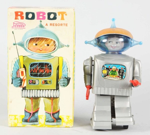 Plastic Battery-Operated & Wind-Up Robot.: Spanish. Made by Joyo. Inner mechanism is loose but working. Includes original box with original insert. Condition Toy (Excellent) Box (Excellent). Size 10 - 1/2" T.
