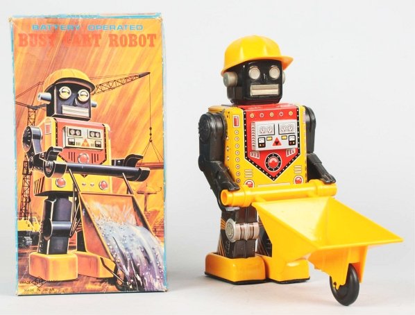 Tin Litho Busy Cart Robot.: Japanese. Made by Horikawa. Some oxidation to chrome. Also, some crazing to box of head. Includes original box with some warping and tears to one end panel in addition to some tape residue. Toy (Excel