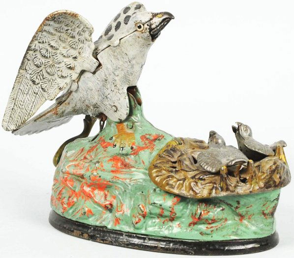 Eagle & Eaglets Mechanical Bank.: Beautiful original working condition. Manufactured by J&E Stevens and Company. Nice fiery highlights to base. Comes with working bellows. Condition (Near Mint). Size 8" L.